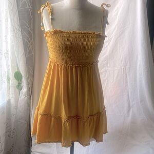 Gold bandeau/smocked shoulder tie mini summer dress.